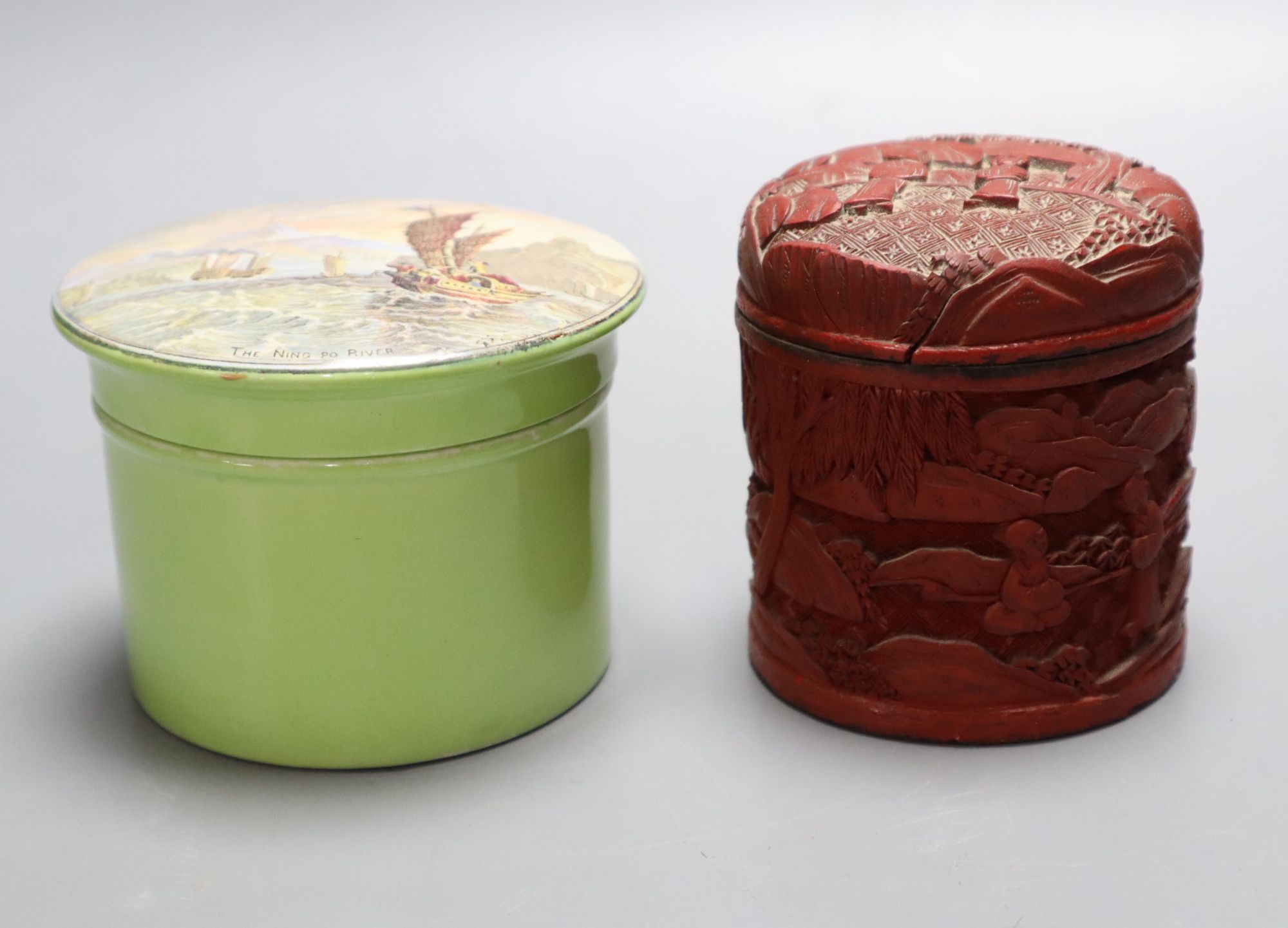 A Chinese cinnabar lacquer cylindrical box and cover carved with figures in gardens and a Ning Po River Prattware pot lid